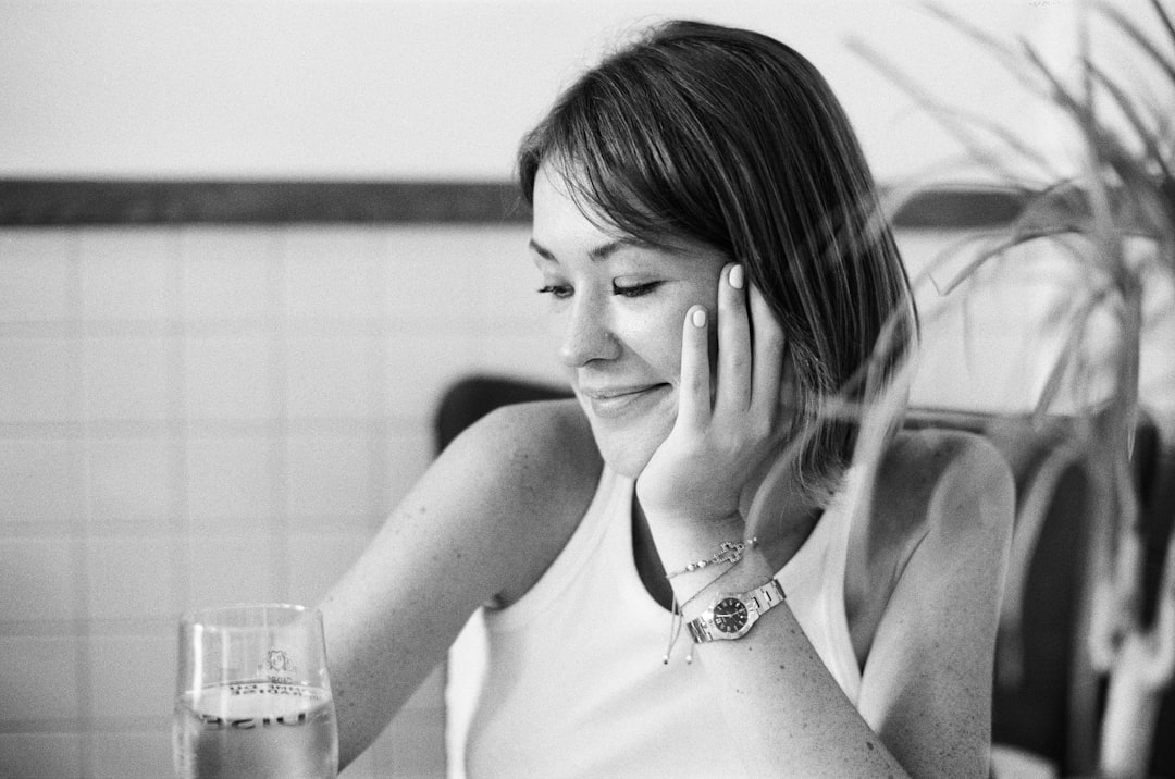 Pregnant woman gently resting hands on her face