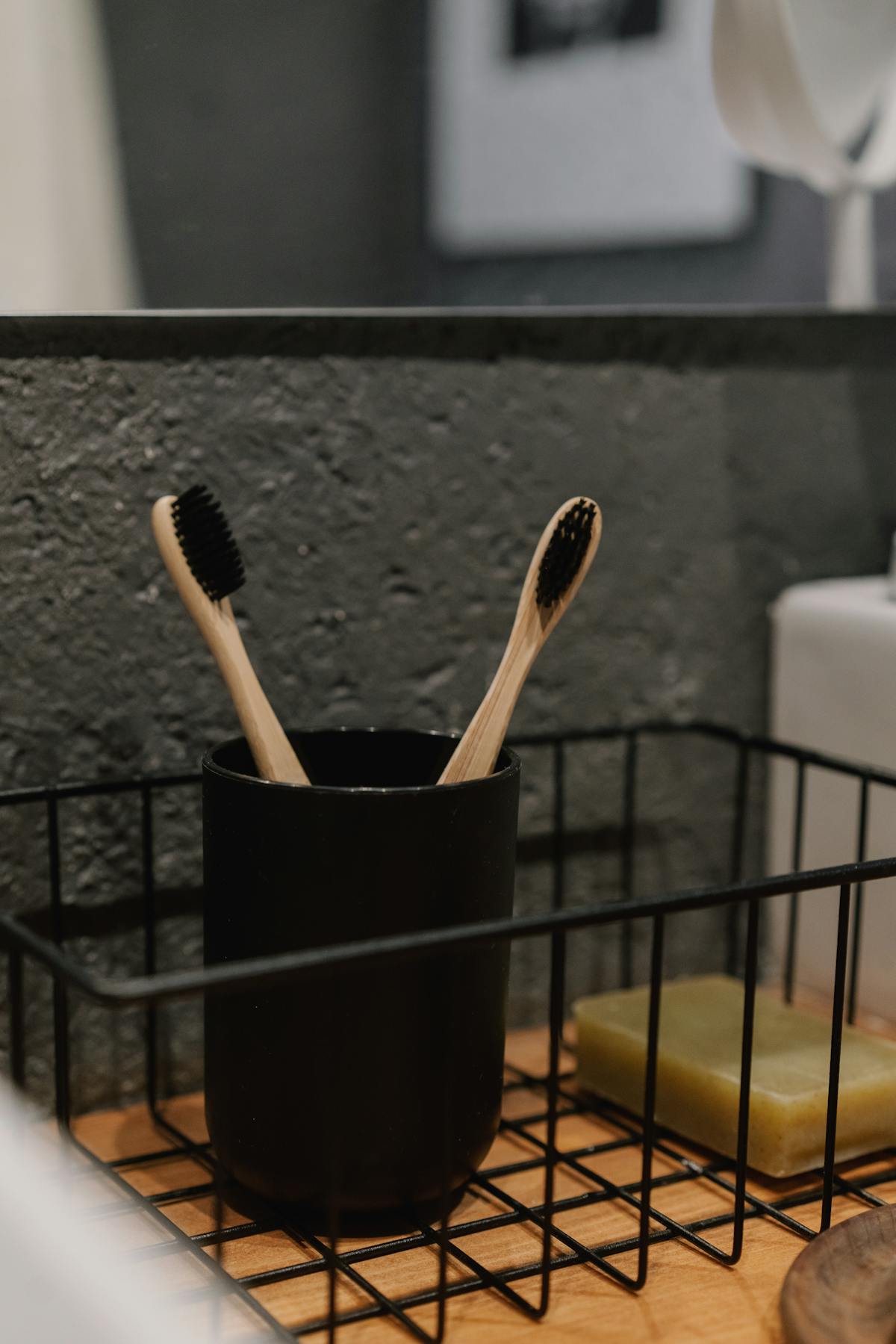 Toothbrushes lined up on a clean bathroom counter