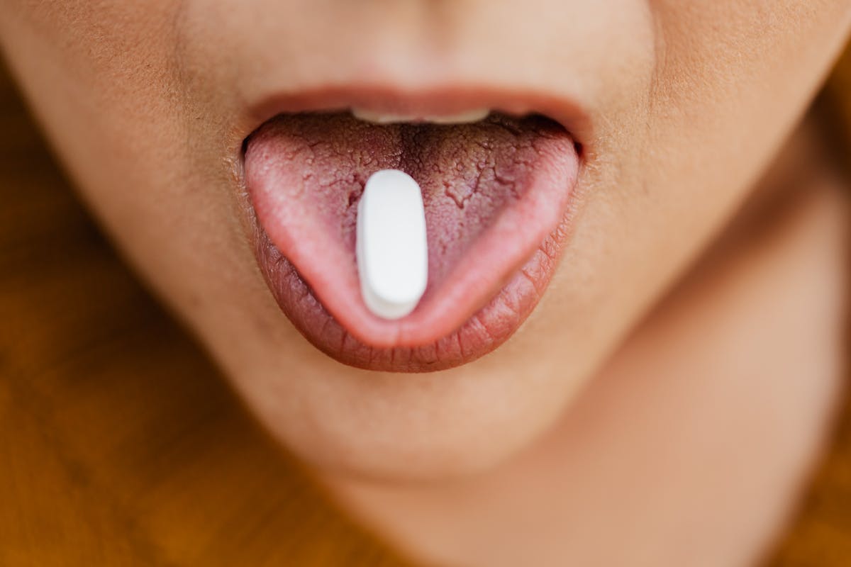 A person caring for tongue and oral health