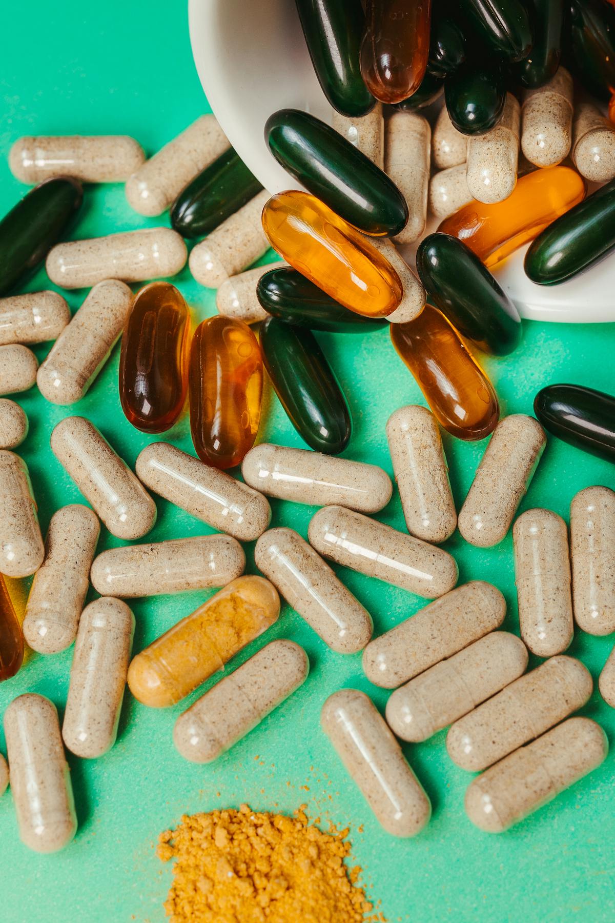 Capsules and supplement bottles arranged on a surface