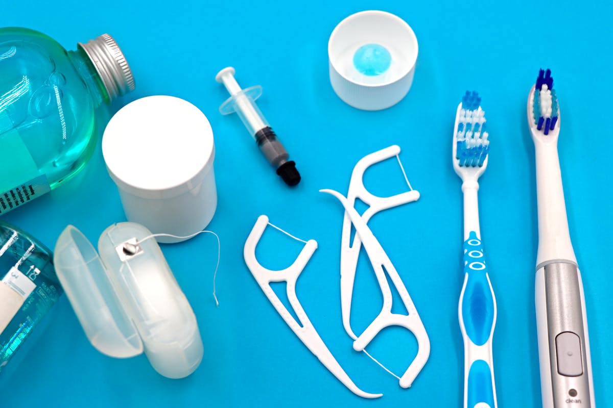 Dental floss being used between teeth